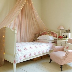 Children's bed on a wooden floor