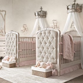 Stylish crib in two girls room