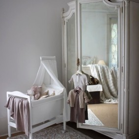Mirrors on the swing doors of the children's wardrobe