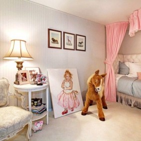 Portrait of a girl on the floor in the nursery