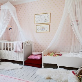 Tulle canopies over girls' beds