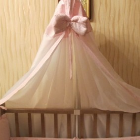 Pink bow on a children's canopy