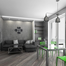 Scaune verzi într-o cameră gri