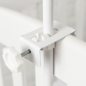 Metal canopy clamp on the bed