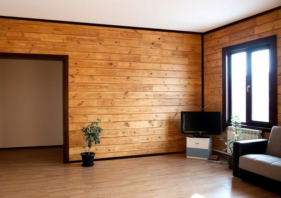 Wall decoration in the house from glued beams