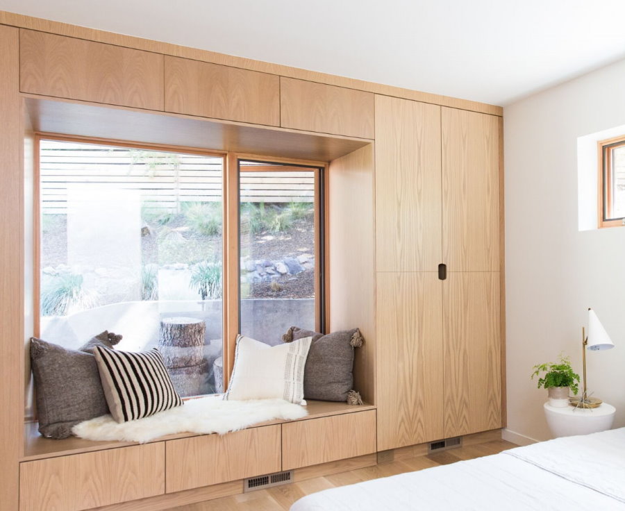 Cabinets around a bedroom window