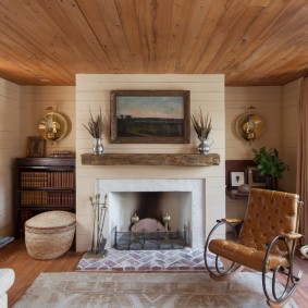 Fauteuil à bascule avec assise en cuir