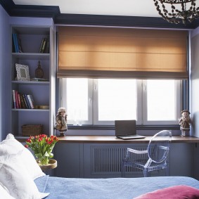 A transparent chair in front of a desk