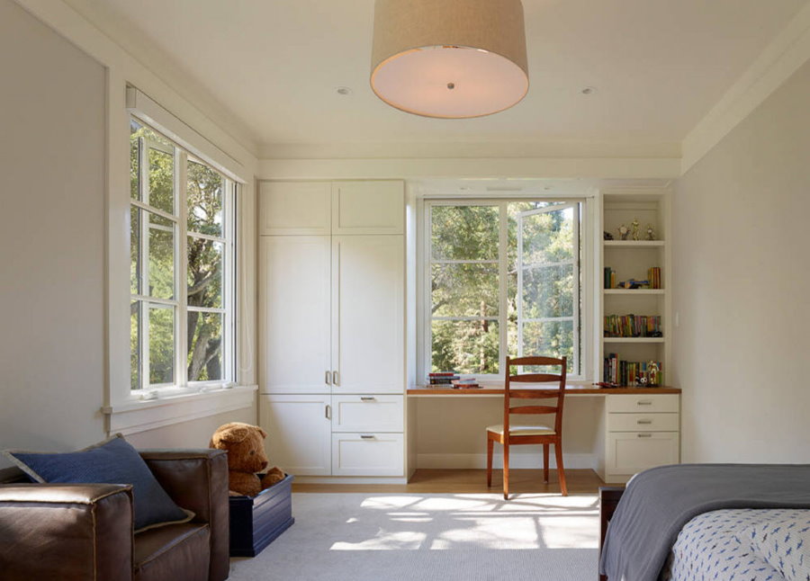 Corner living room with wardrobe around the window.