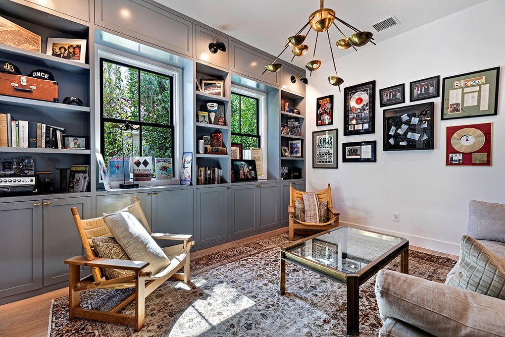 Built-in furniture between the windows of the living room