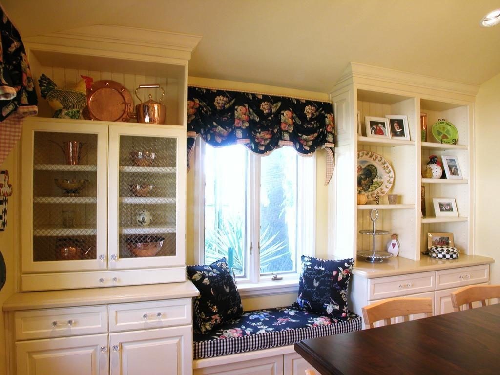 Cabinets for kitchen utensils around the window