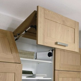 Drawer with lifting door for kitchen furniture